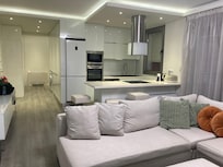 Lounge/kitchen leading onto balcony