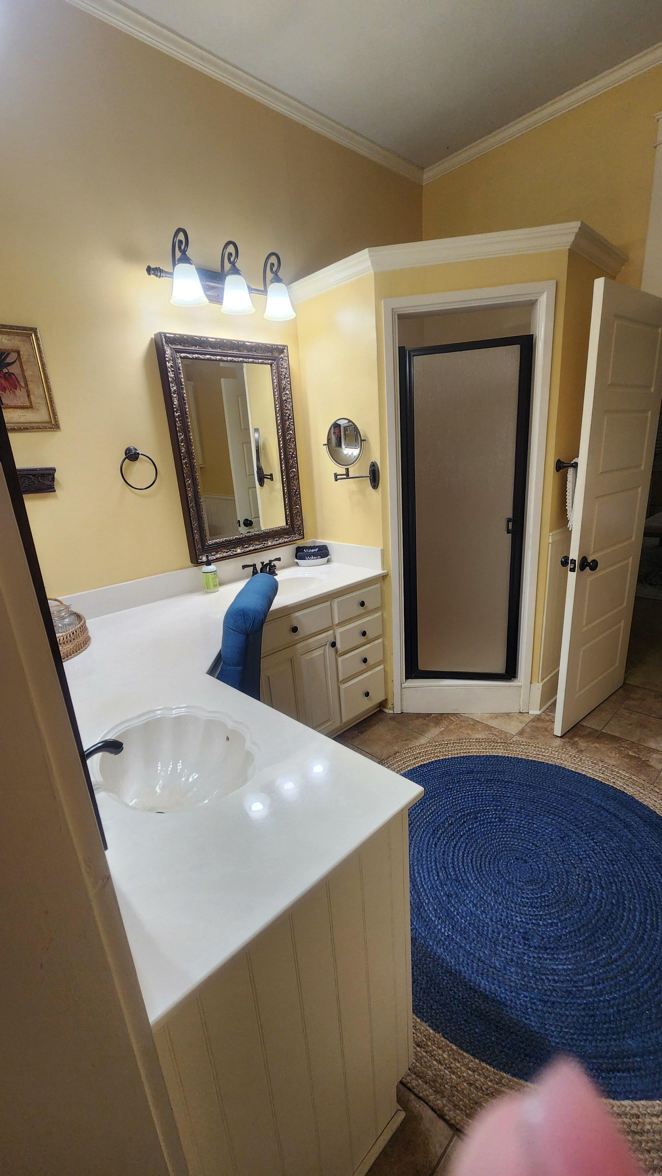 From closet across bathroom (tub to the right)