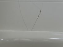 Cracked wall tile above tub