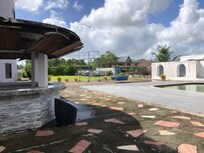 Pool not available and pool area surrounded by rusty cars