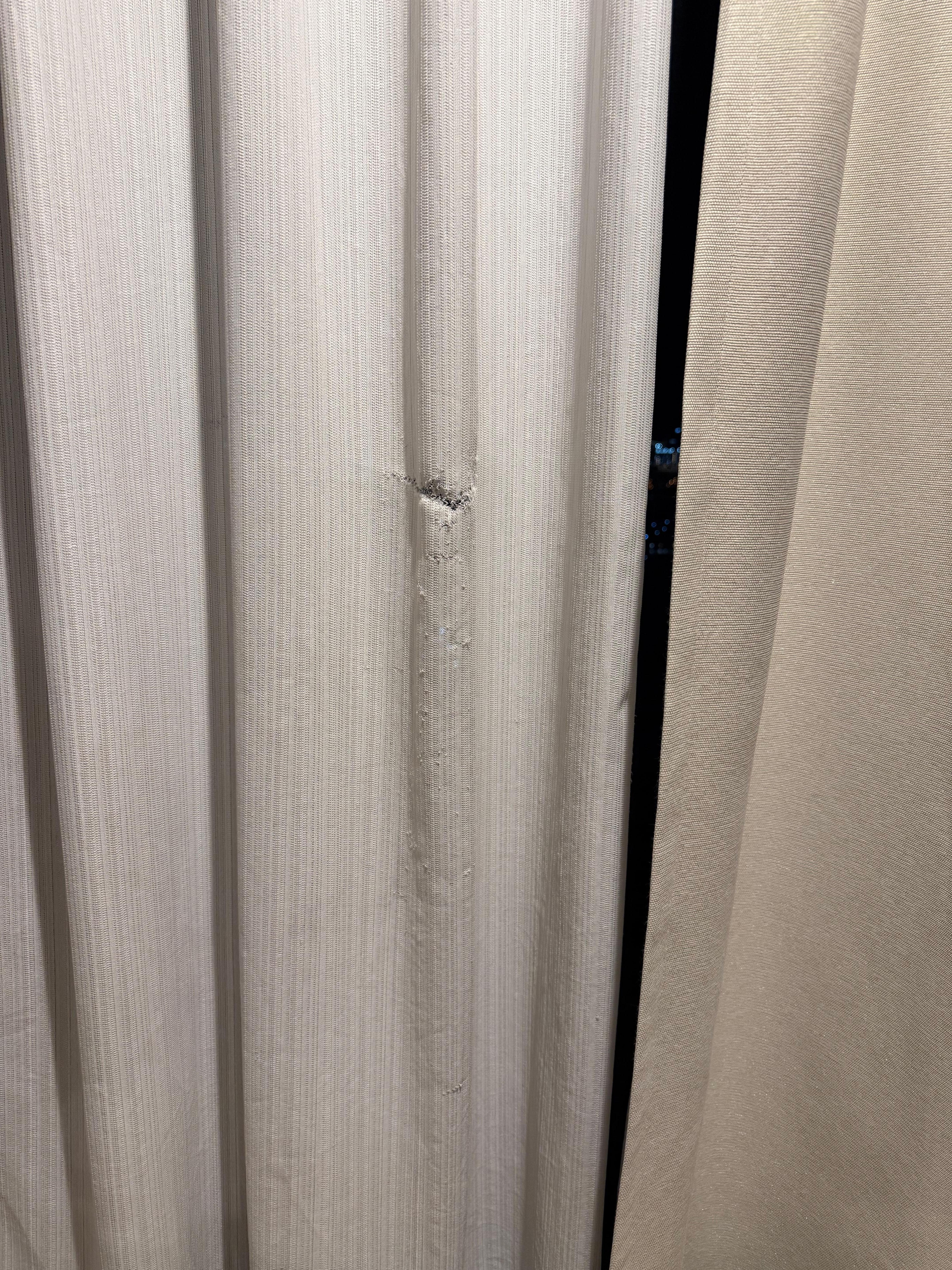 Damaged curtain.