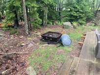 Firepit was filled with garbage we had to clean out.