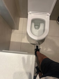 Toilet was less than a foot from counter.  Impossible to stand or sit on it correctly
