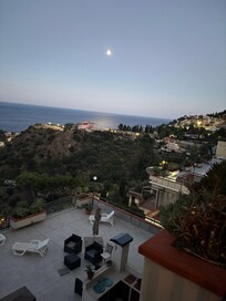 Beautiful view of Taromina, the sea and hills