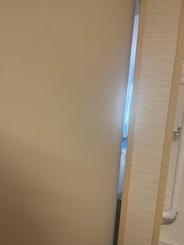 Looking through the door gap into the bedroom