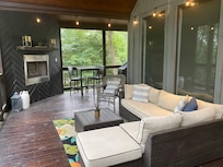 Beautiful back porch to sit and watch the rain fall or the sun shine.