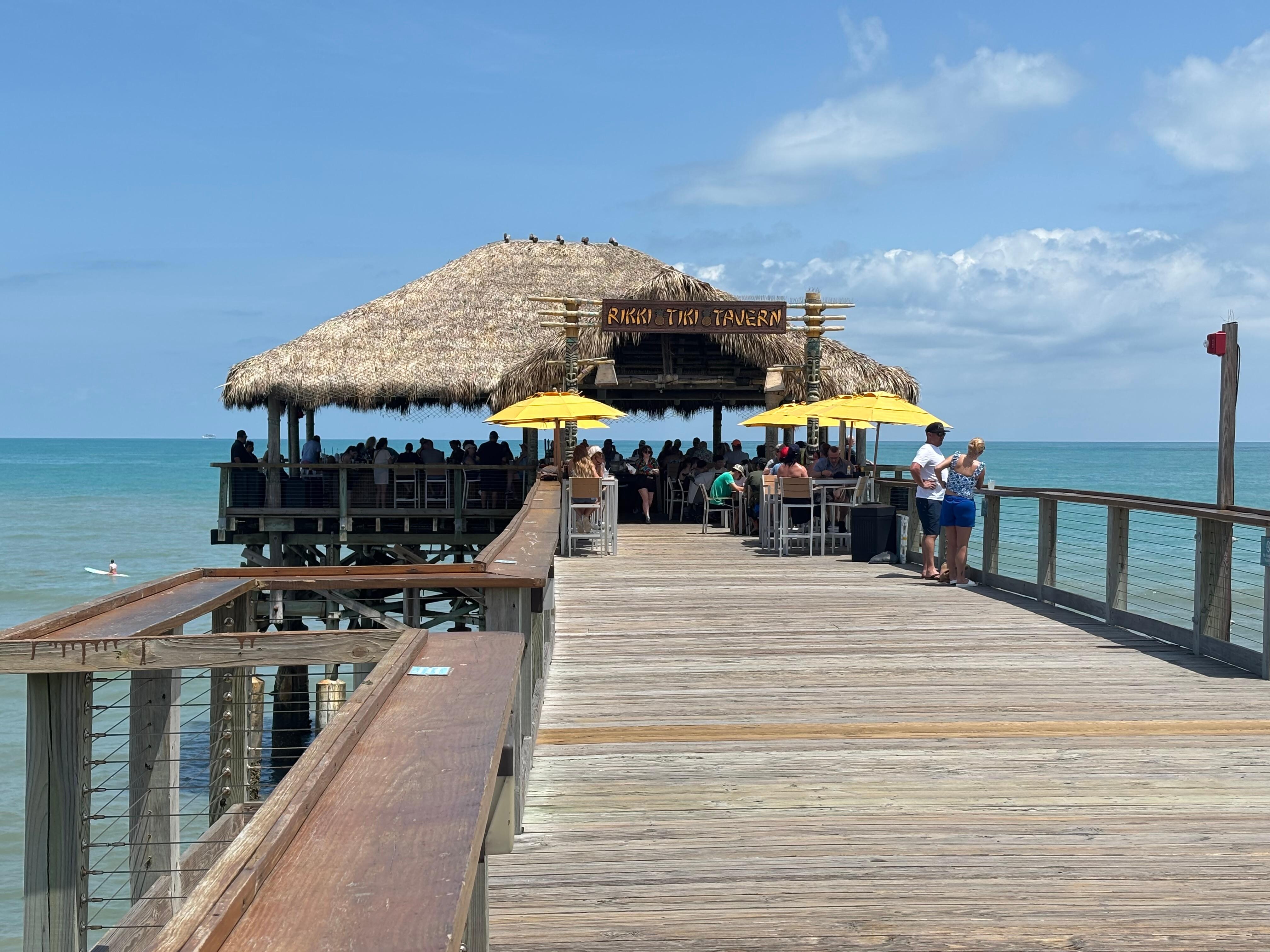 Check out the Cocoa Beach pier at happy hour