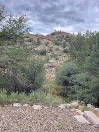 Behind the cabin.