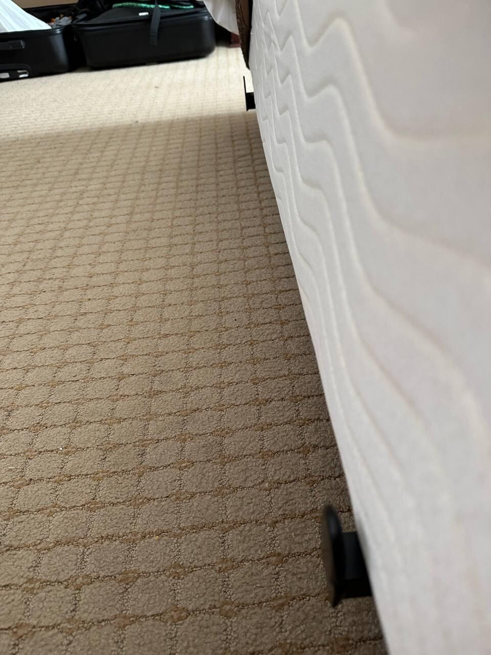 Metal protruding out from base of bed 
