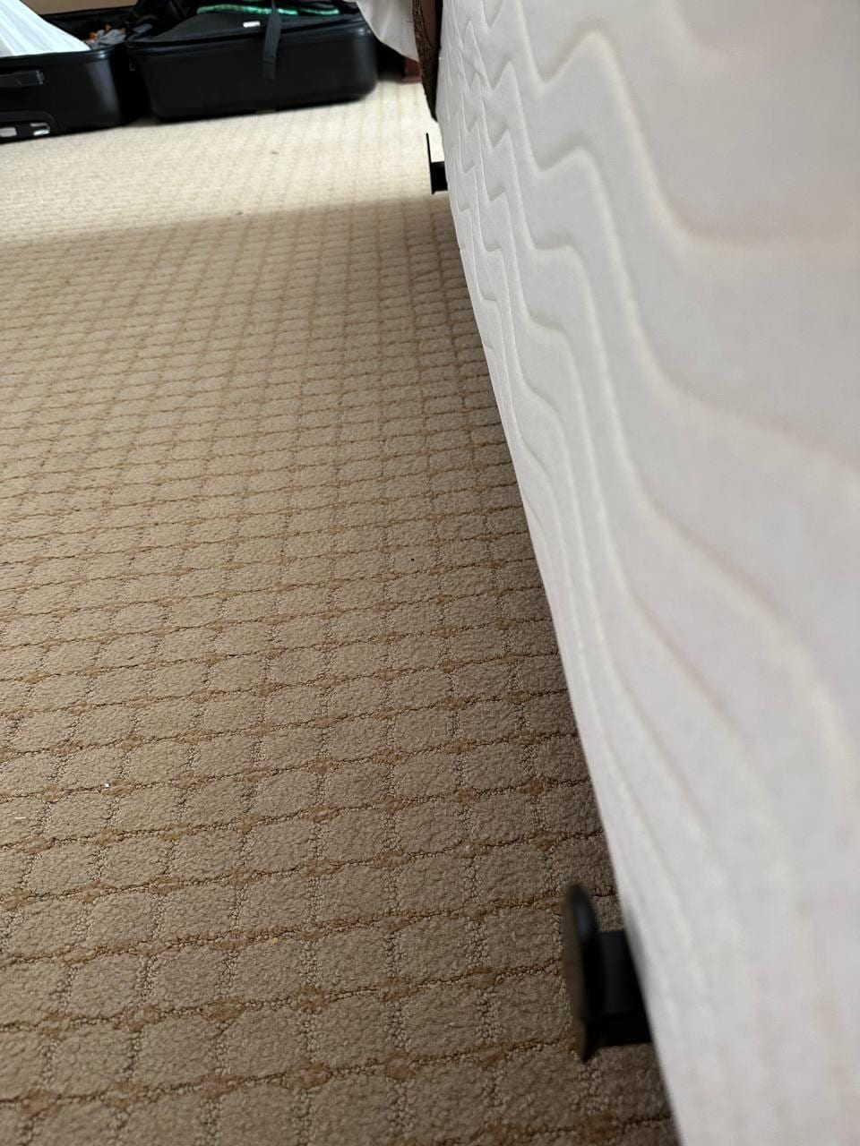 Metal protruding out from base of bed