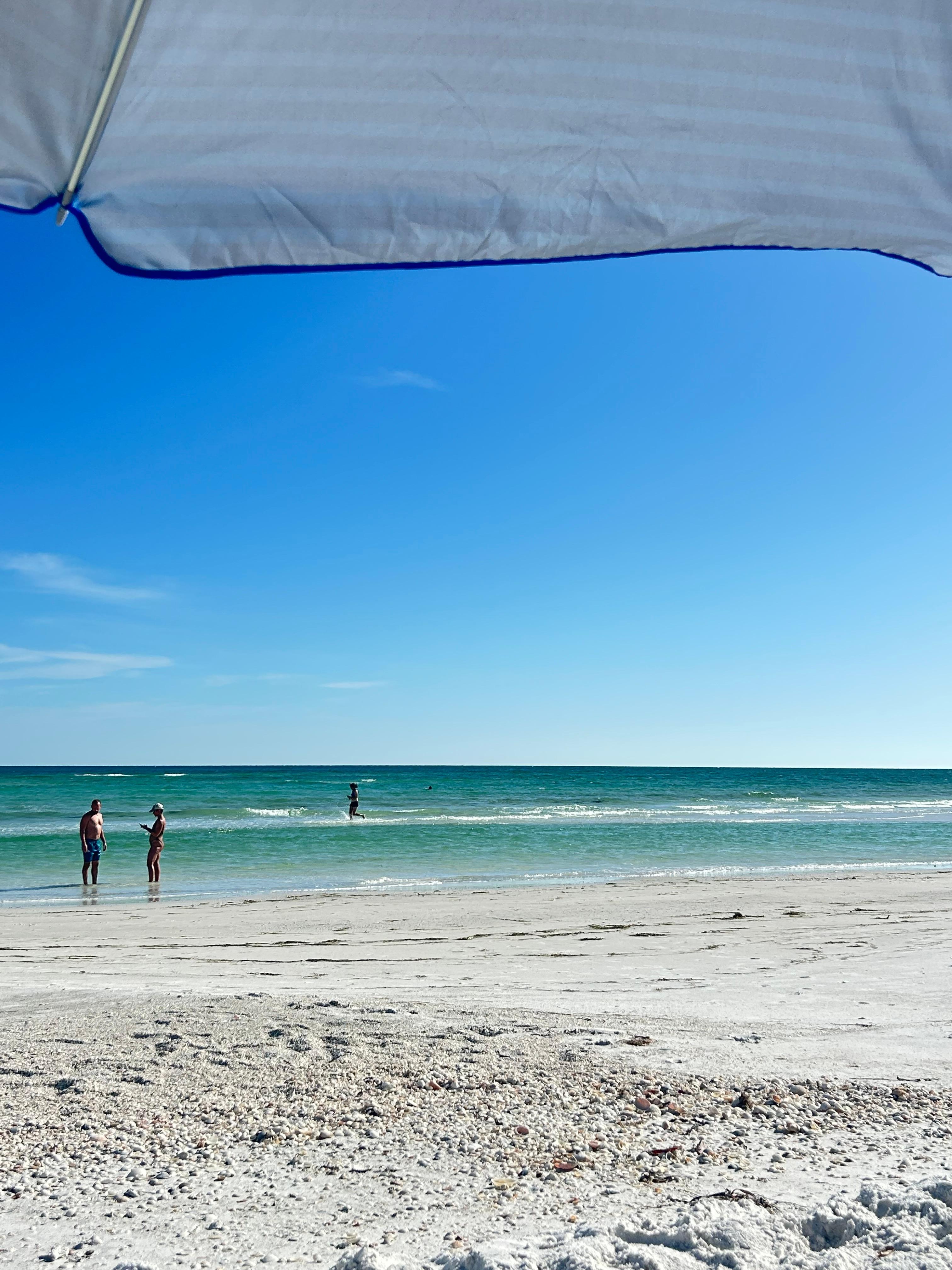 Water is so clear and blue.  The water was so warm and many sandbars when we were there. 