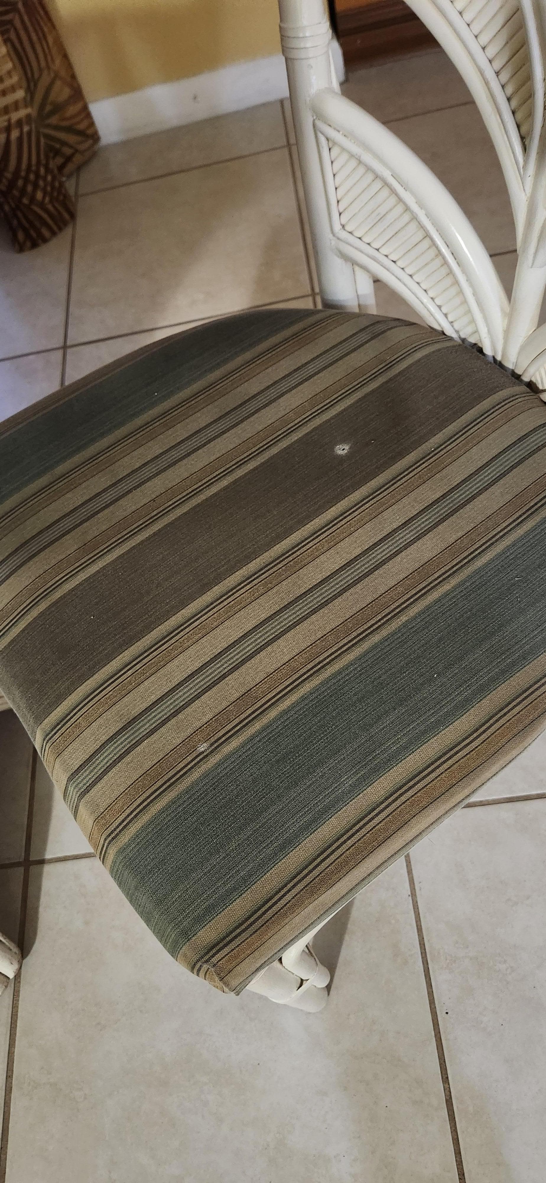 Filthy dining chairs with burn marks.