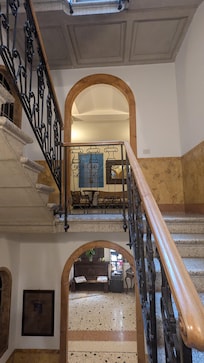 Reception on first floor and short flight of stairs to bedroom.
