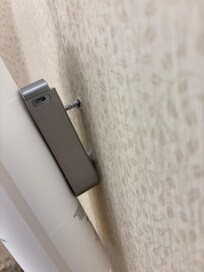 Lotion hanging out of wall