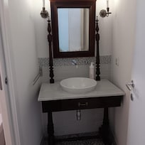 Second bathroom has dim light for applying makeup.