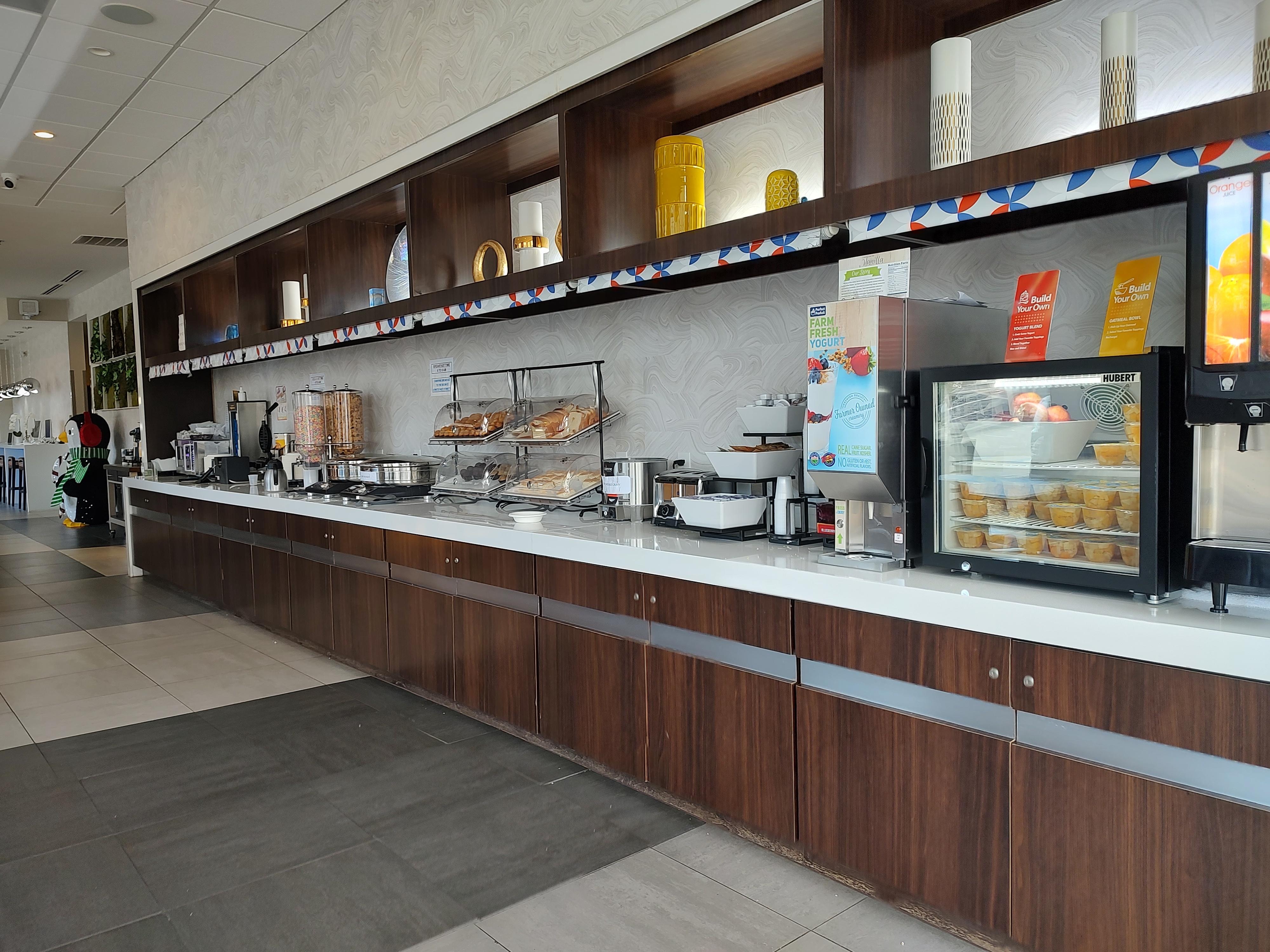 Waffles, eggs, yogurt (from dispenser), sausage, cereal, fruit, biscuit + gravy, few other items.