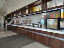 Waffles, eggs, yogurt (from dispenser), sausage, cereal, fruit, biscuit + gravy, few other items.