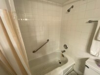 Gross tub, rust and black mold.