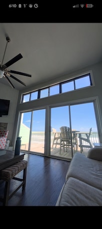 Wall of windows with no curtain but amazing views and great porch. Great location!