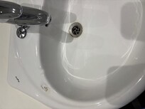 Damage on sink brown marks round plughole