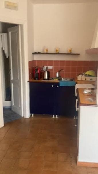 Downstairs: The kitchen and bathroom to the left