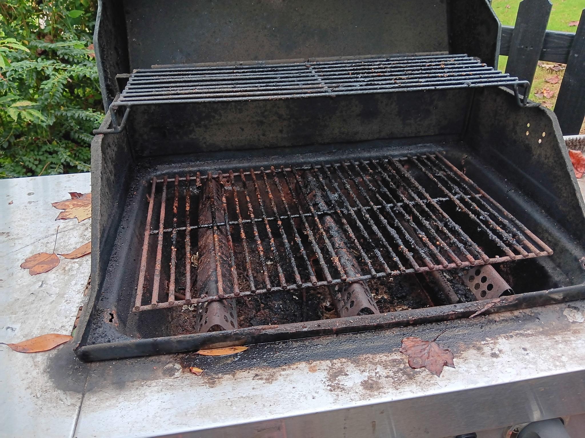 Filthy backyard grill.