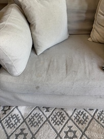 Stained, worn sofa
