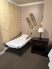 A small bed in the primary room