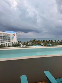 View from our room with our pool and ocean view