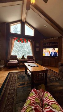 The living room with big window to see the snow falling
