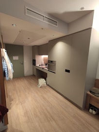 Spacious room with fully equipped kitchen.