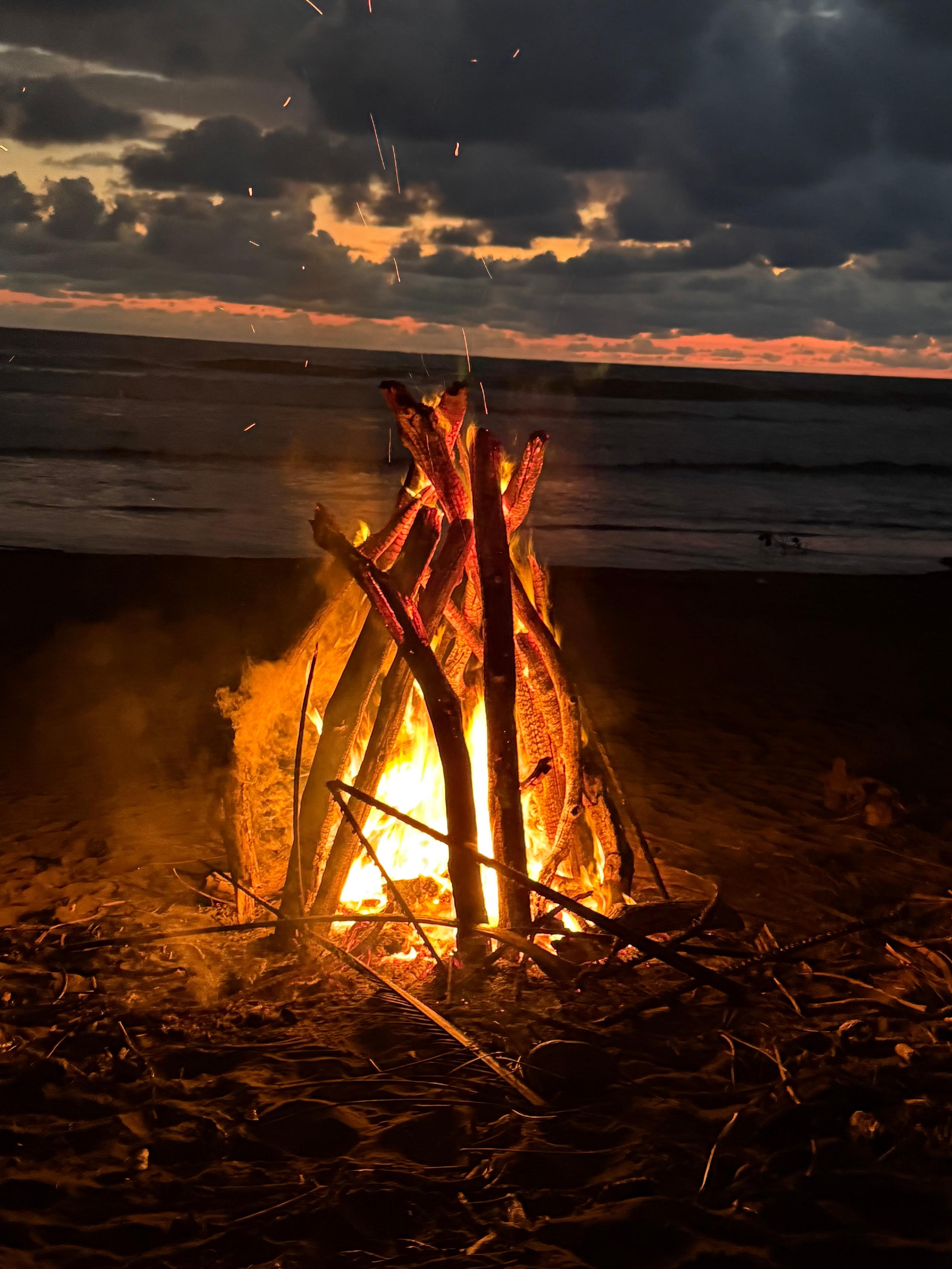 top off the day with a sunset fire on the beach