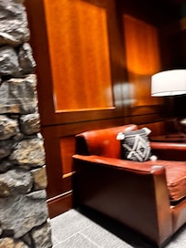 Warm wood and stone and comfortable chairs are in abundance