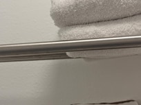 Hard to see but hairs hanging from towel wrack