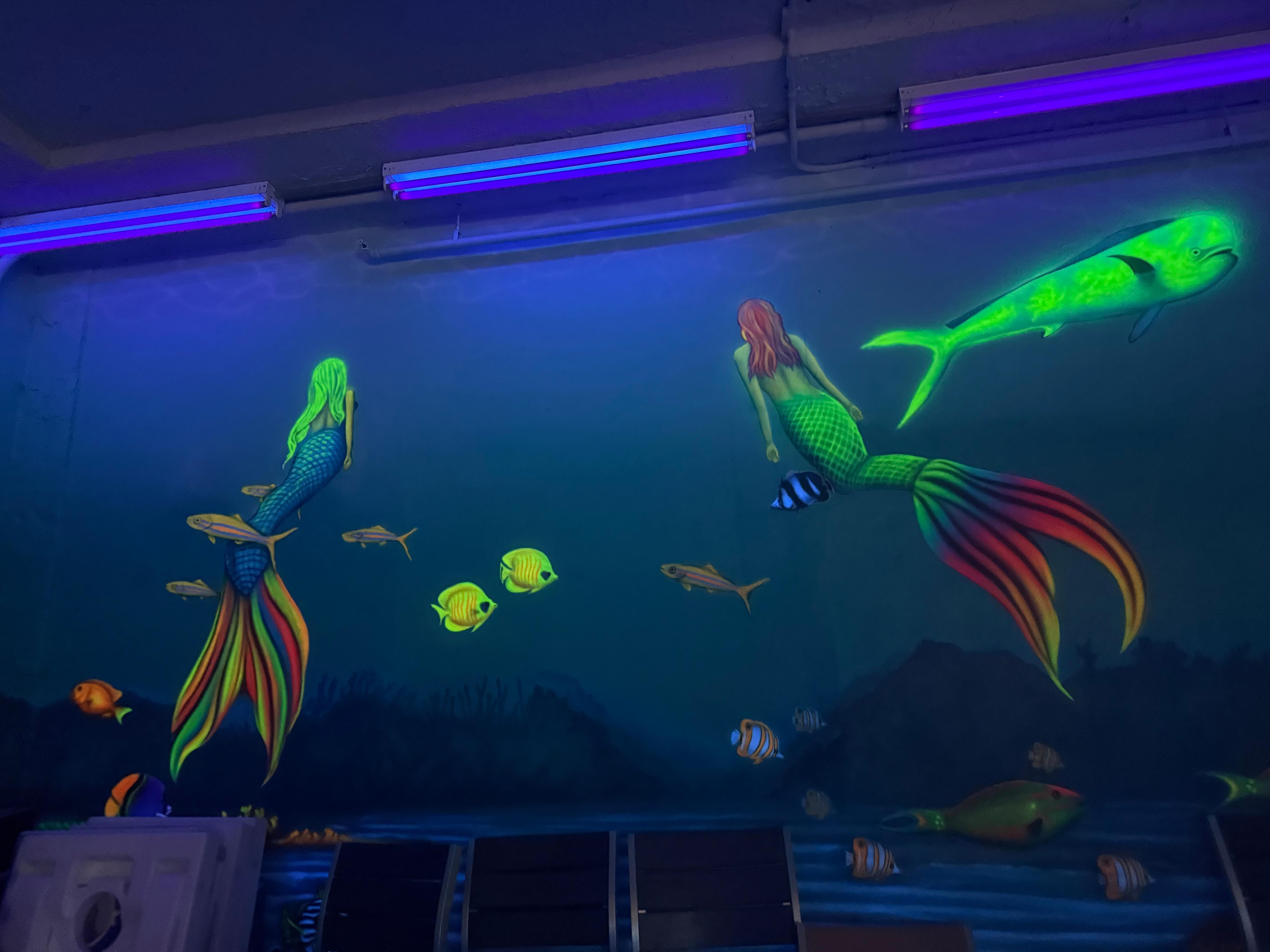 Painting on the wall at the beach bar downstairs 