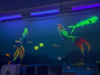 Painting on the wall at the beach bar downstairs