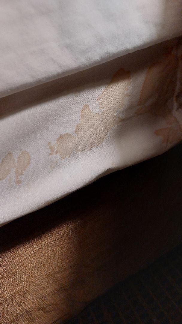 some sort of stain on the sheets not sure of what it is but no excuse to have it that way when someone arrives