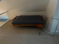 Futon in loft on broken frame, you can also see the broken safety door