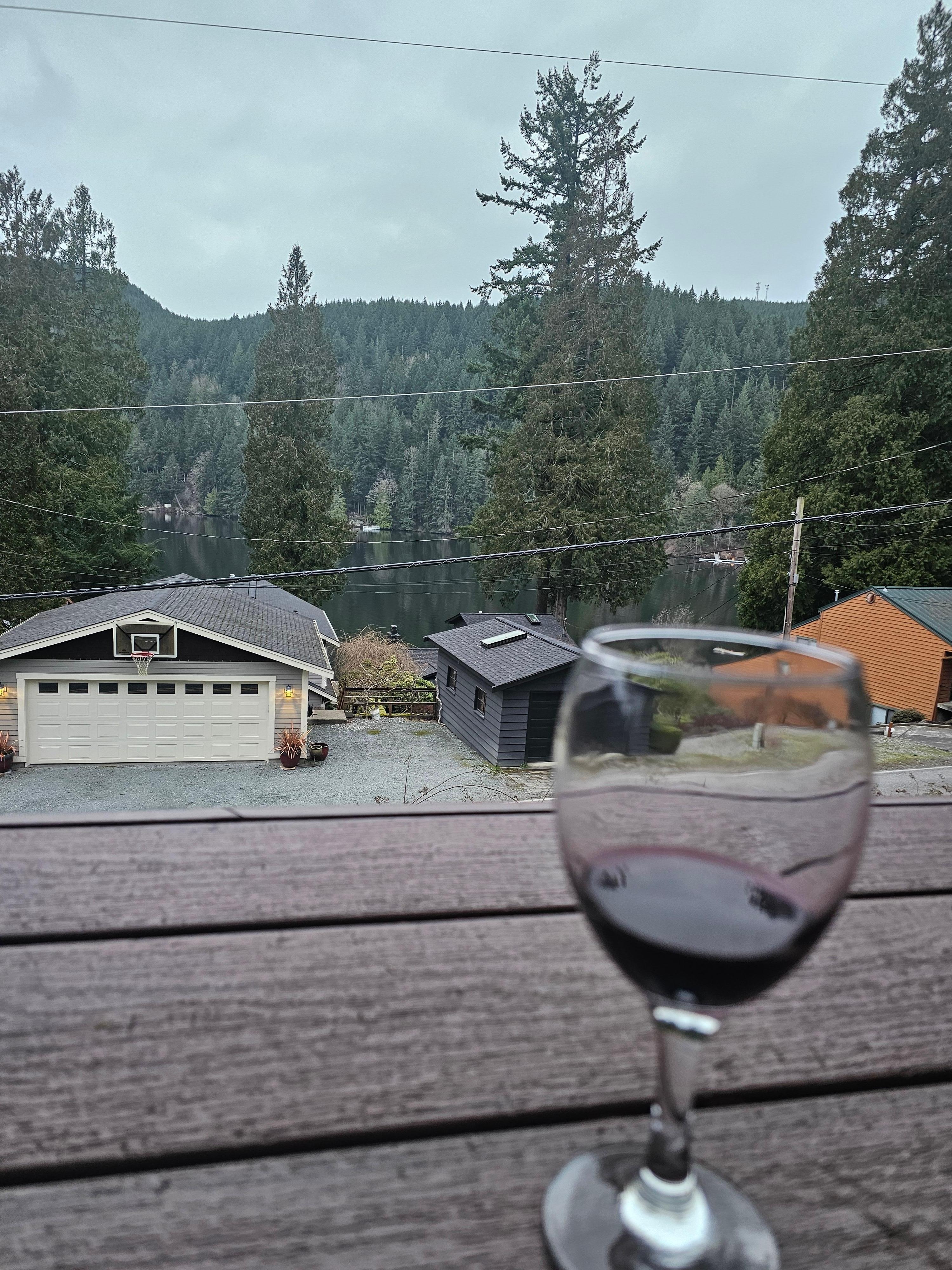 Relaxing on the patio overlooking lake Samish with a glass of vino.