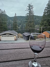 Relaxing on the patio overlooking lake Samish with a glass of vino.