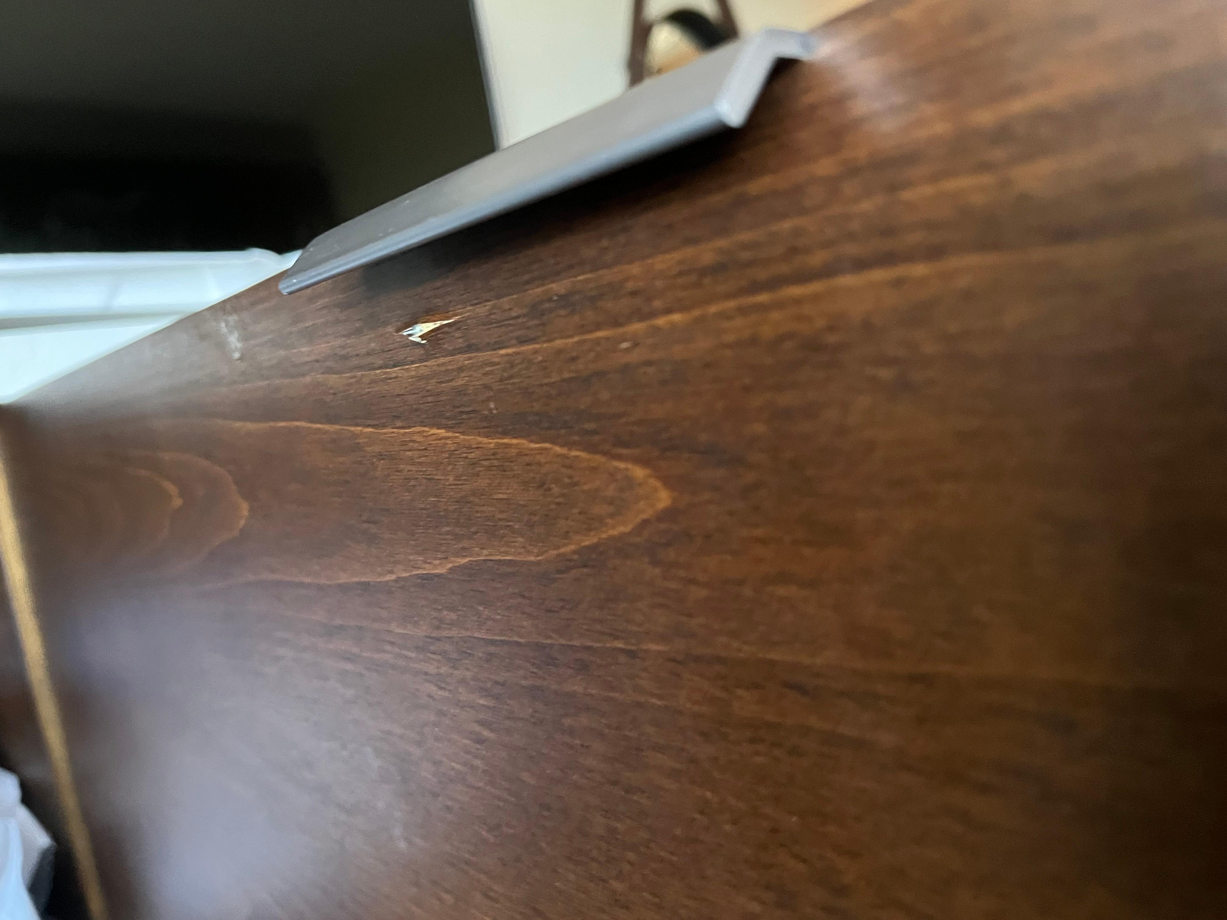 Screw coming through the door to the fridge 