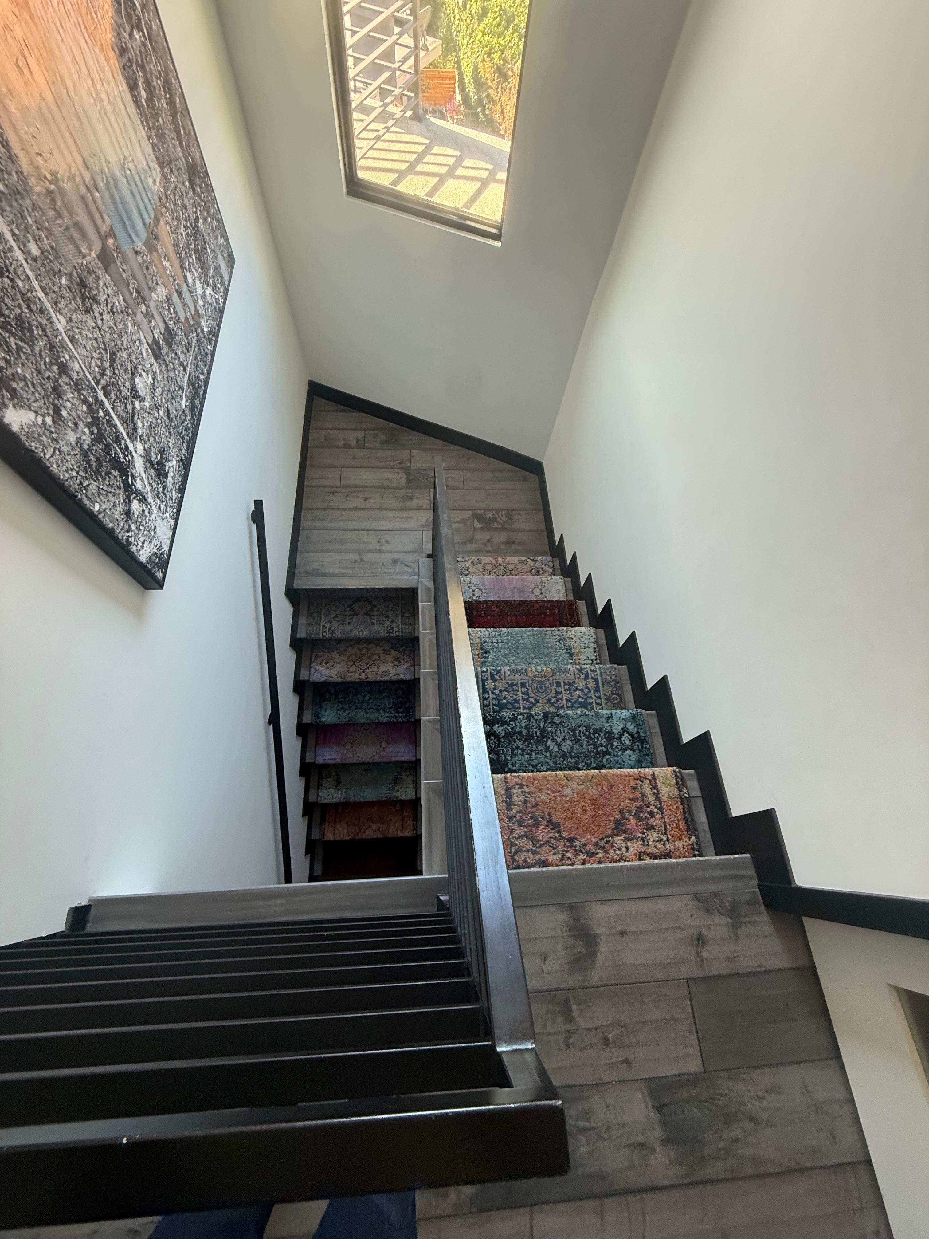 View of staircase.  It is 28 stairs from the main level to lower bedroom and "lounge/4th bedroom" 