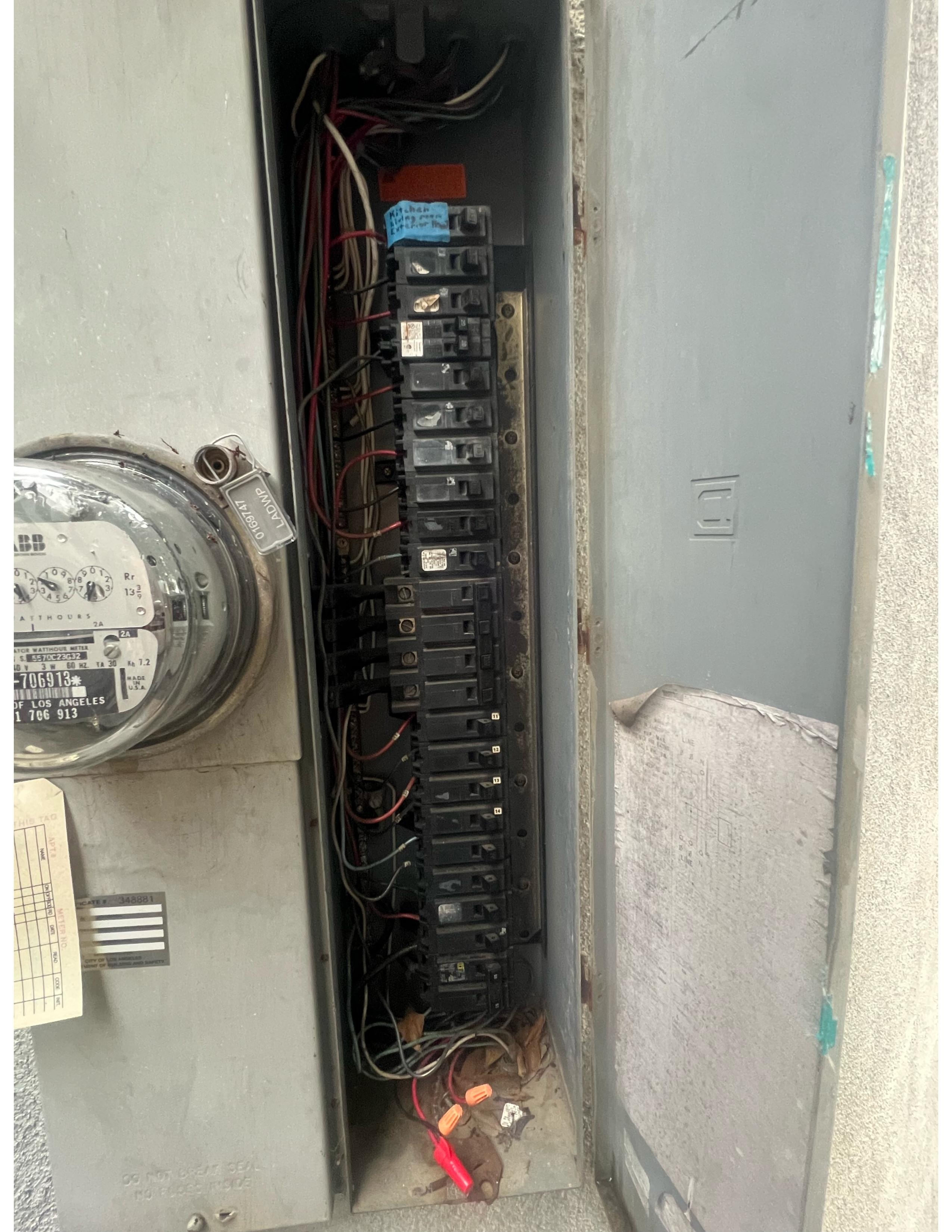 Circuit breaker used 2X/day; note identification of Living Room/Kitchen 