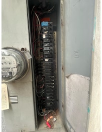 Circuit breaker used 2X/day; note identification of Living Room/Kitchen