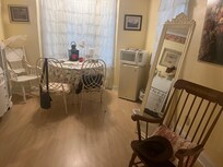 Room complete with microwave, fridge, and table
