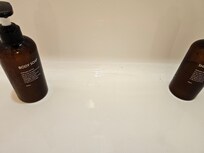 Crack in squishy upstairs shower. Bottle for size reference.