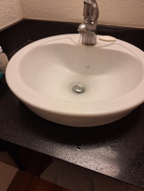 Sink sprayed water everywhere, even to floor.