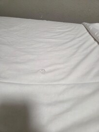 Hole in dirty sheets