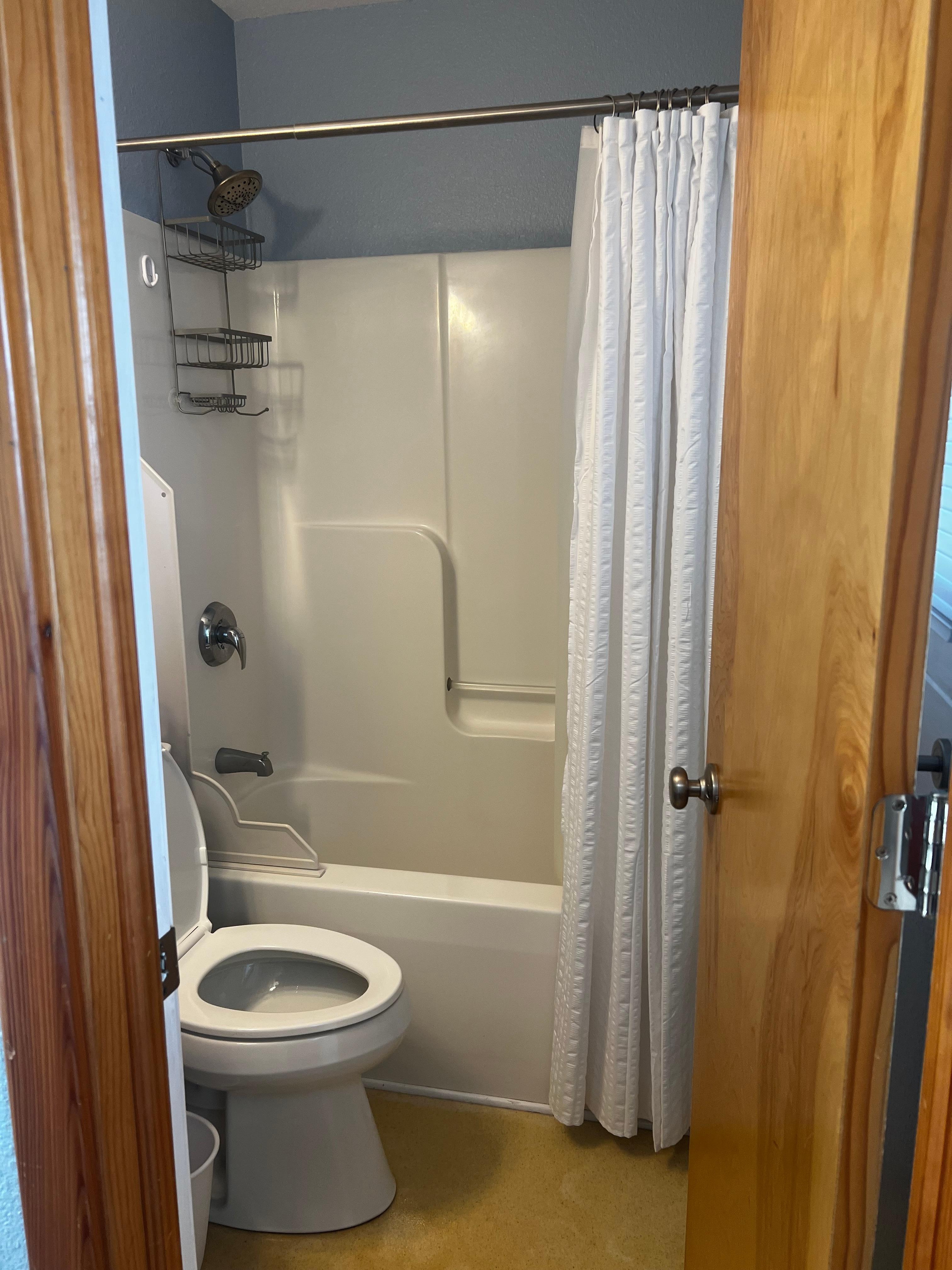Bathroom on right inside the door 