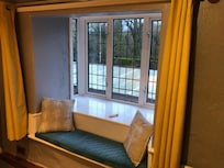Quirky window seat looking towards village church